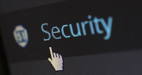 A computer screen with a hand/cursor pointing to the word "security"