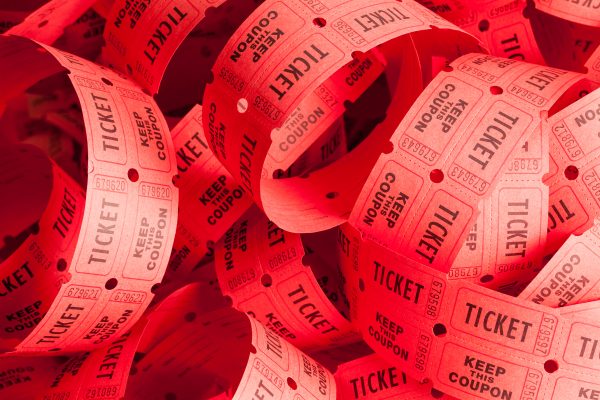 Unwound Messy Roll of Red Tickets Piled Up illustrating the Selling Ticketed Events Online blog post