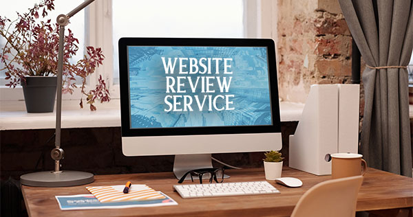 desktop computer with the words "website review service" on the screen