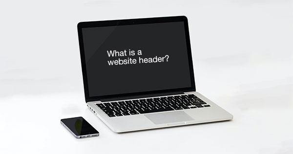 Laptop open with text on the screen that says "what is a website header?"