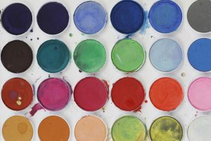 website color scheme illustrated as cans of paint
