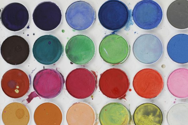 website color scheme illustrated as cans of paint