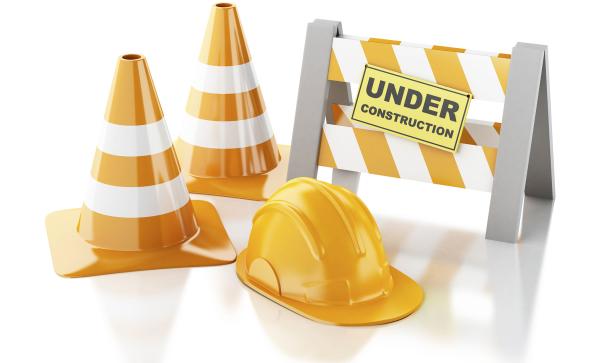 Why building your own website won't save you money illustration of a hard hat and construction warning cones